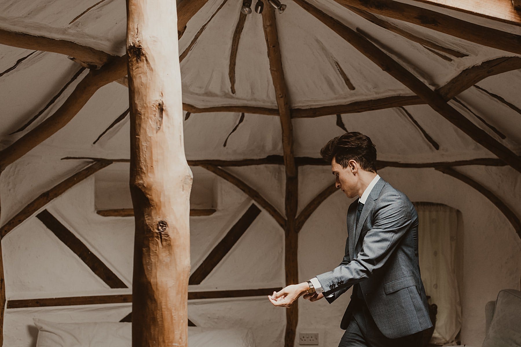 Groom getting ready in yurt