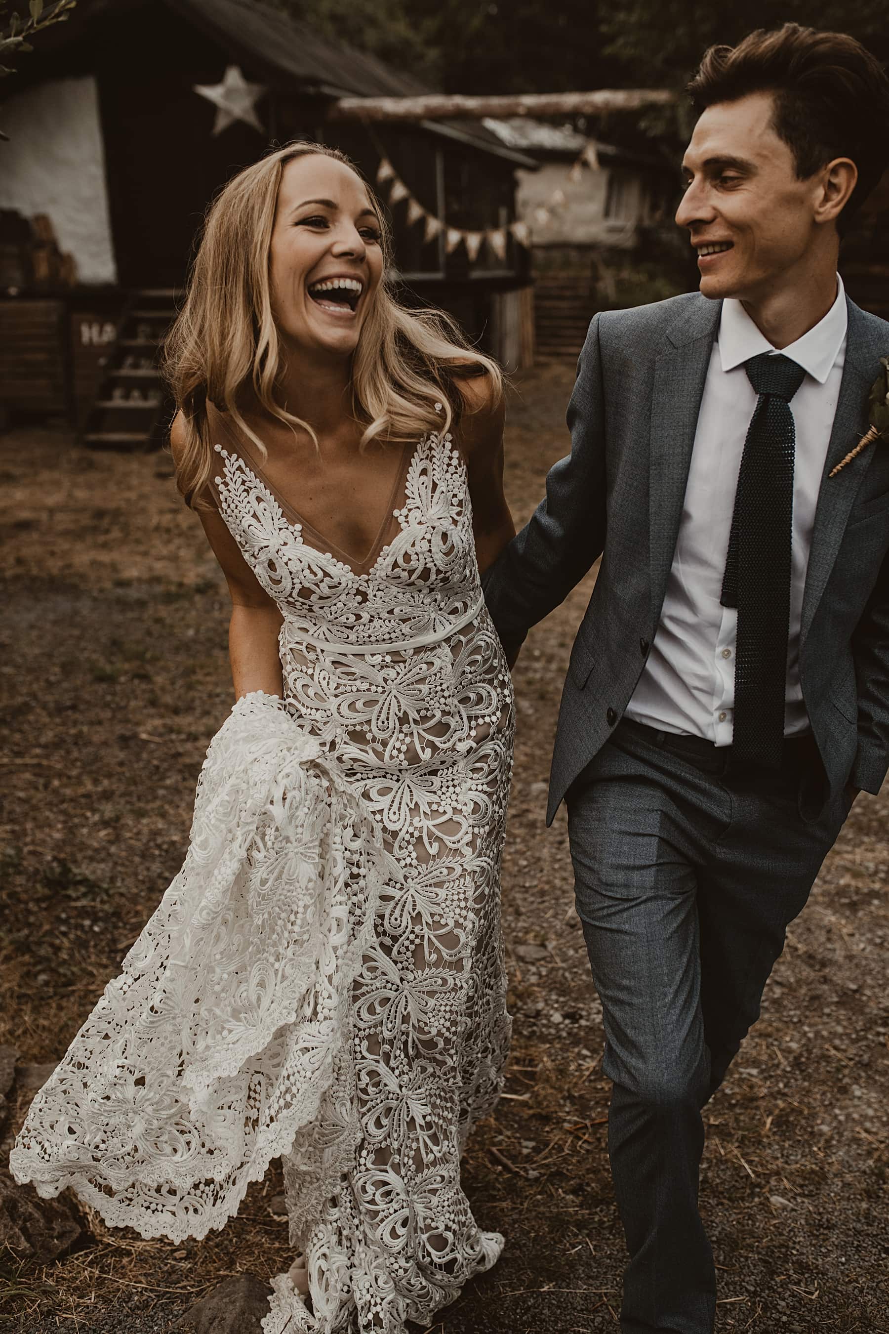 Bride and groom laughing 