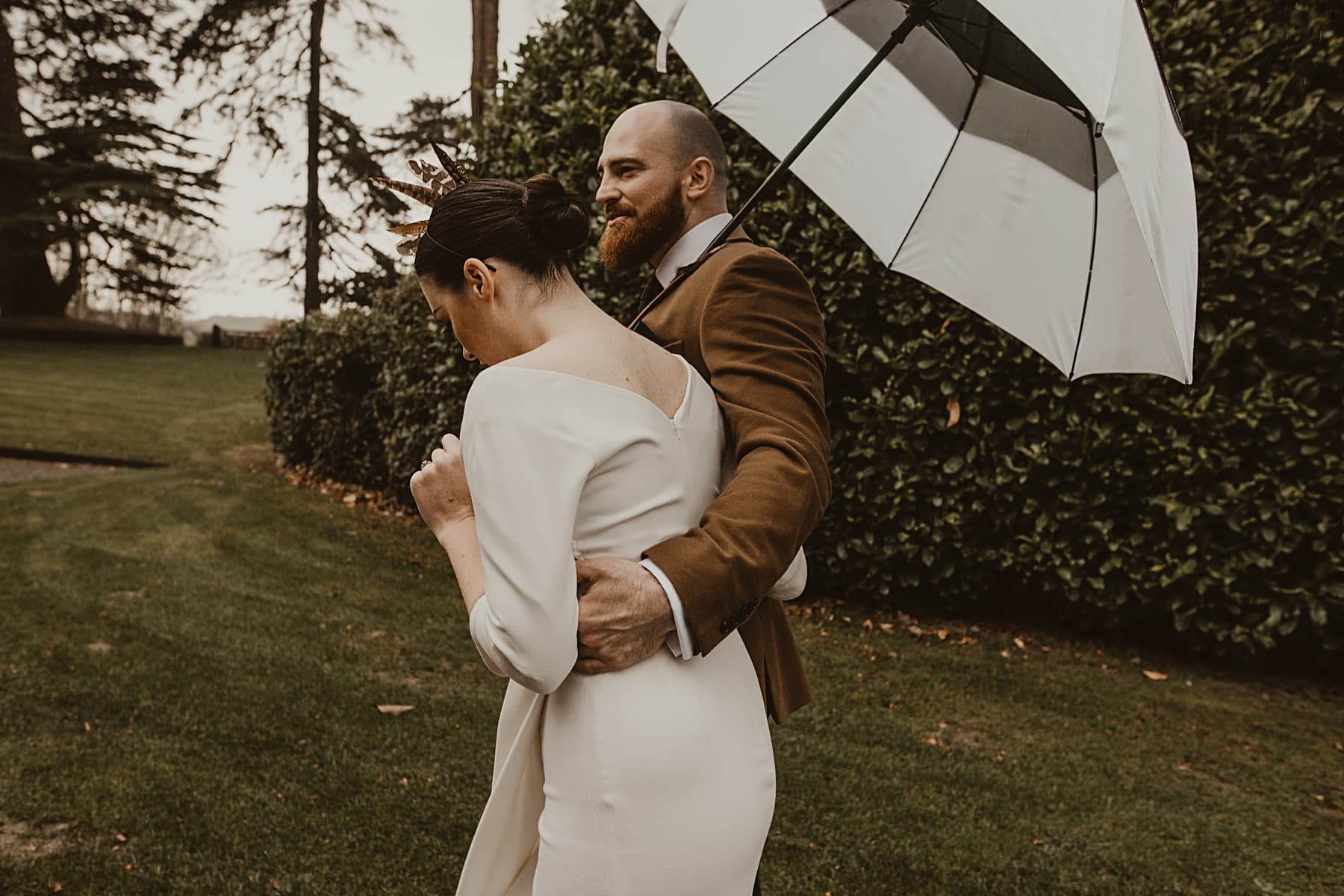 Couple walking with umbrella