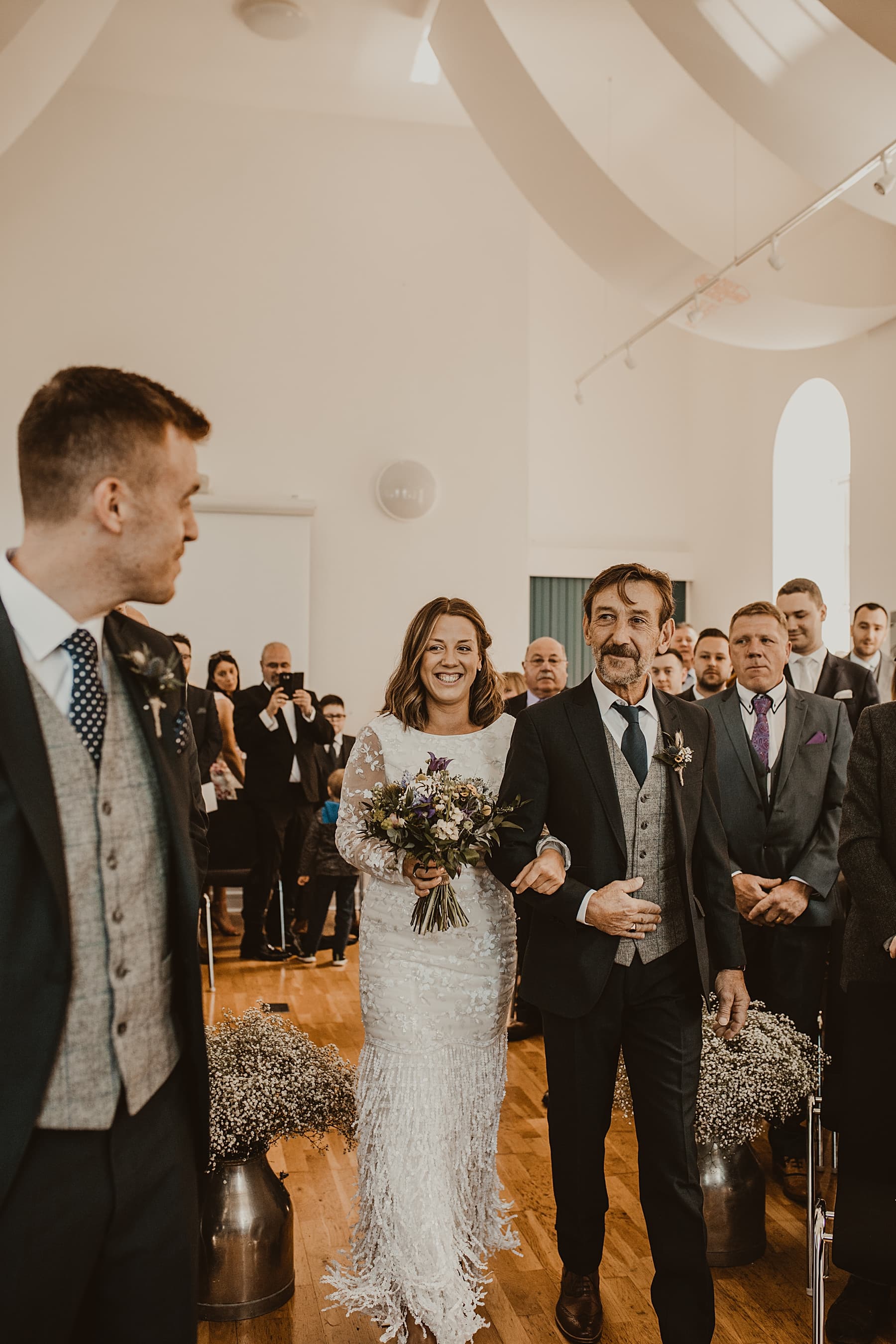 Bride and her dad walking down the aisle