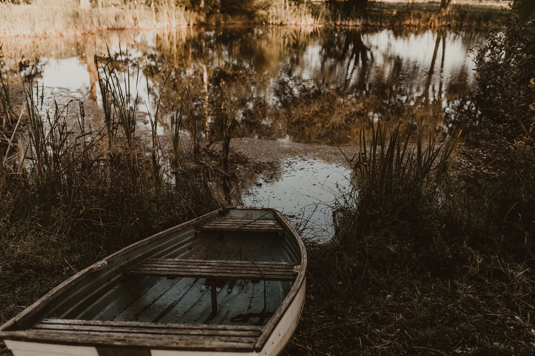 rowing boat next to lake