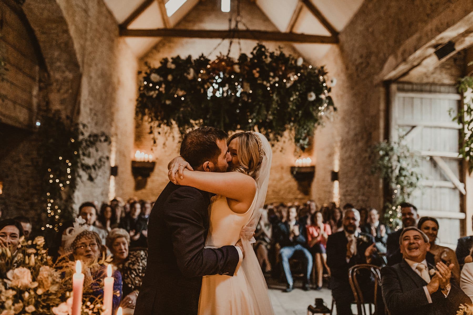 First kiss at Stone barn wedding