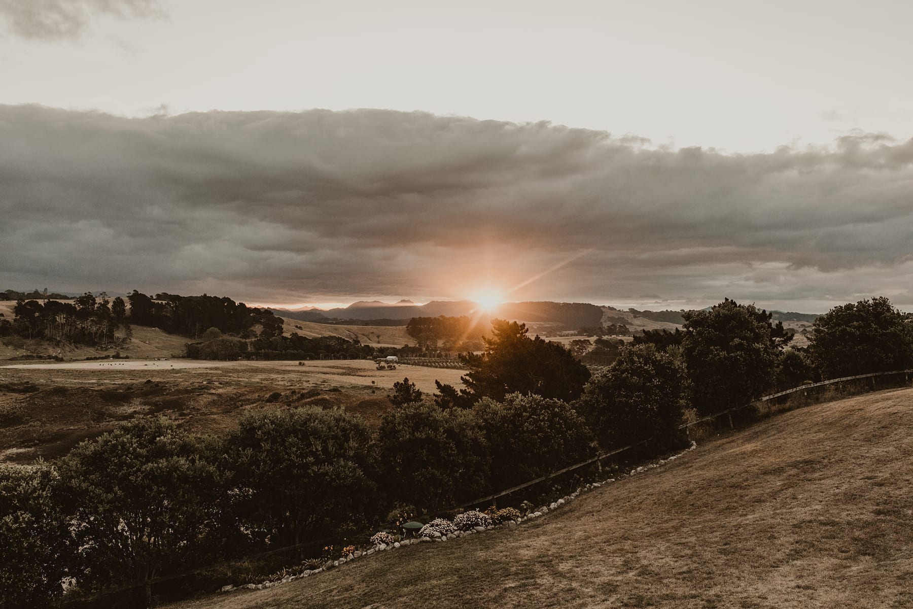 sun setting over landscape